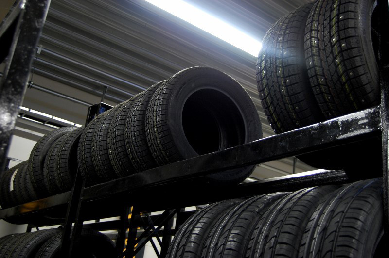 Storing winter and summer tires inside on a tire rack