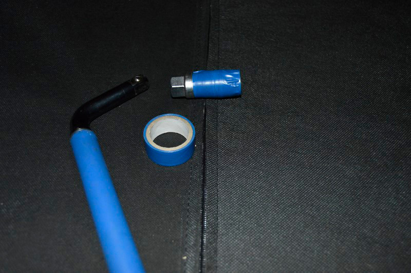 Tape covered socket with wheel wrench
